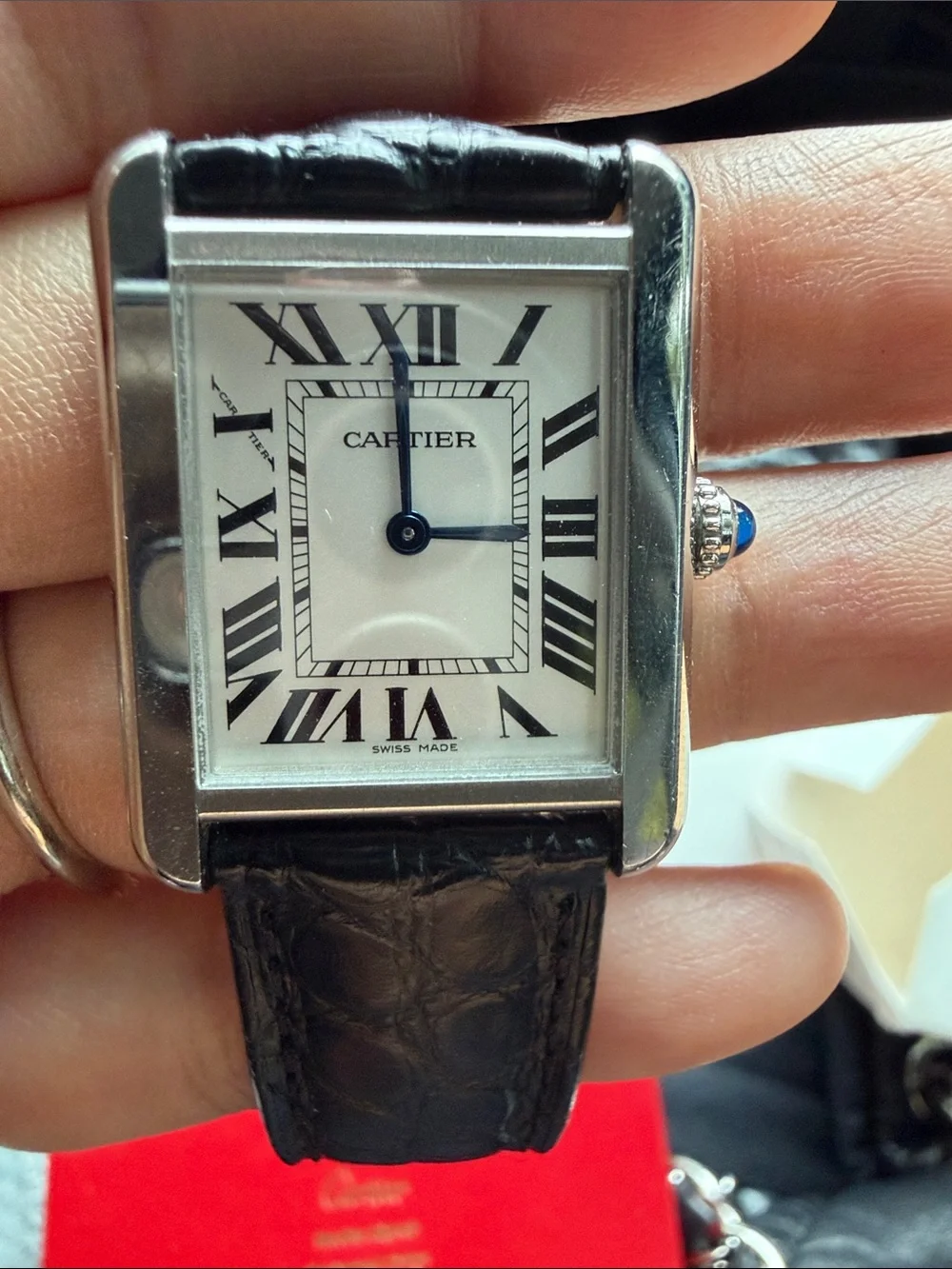 Cartier Tank Watch with Silver Case and Black Leather Strap